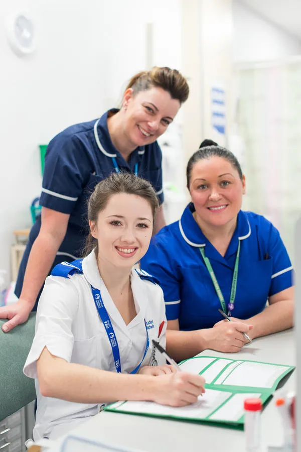 Three nurses working together 
