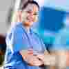An ODP student in surgical scrubs standing outside the allam medical building