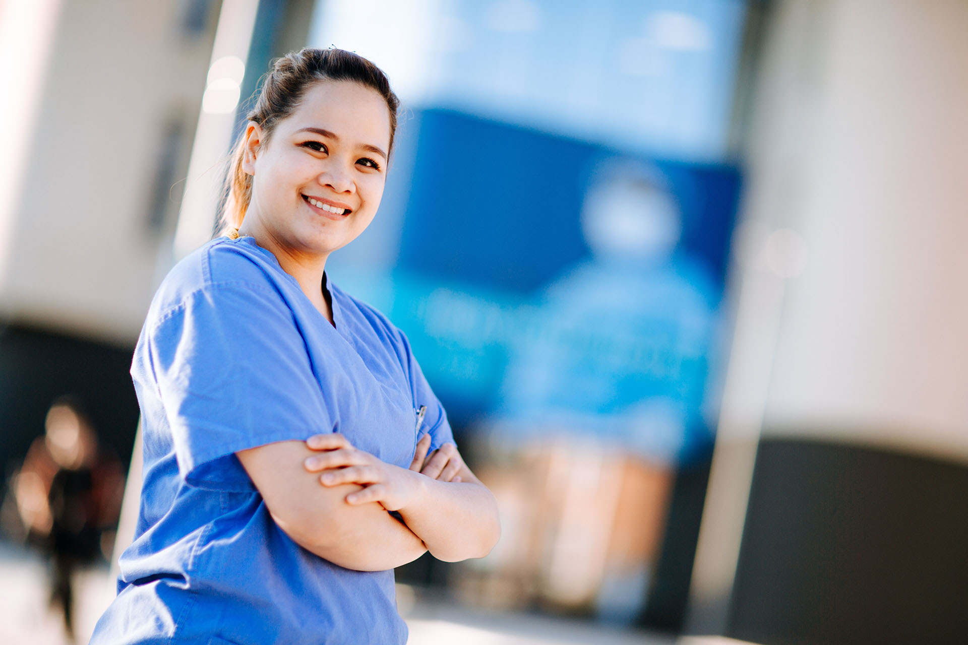 A women wearing black scrubs 