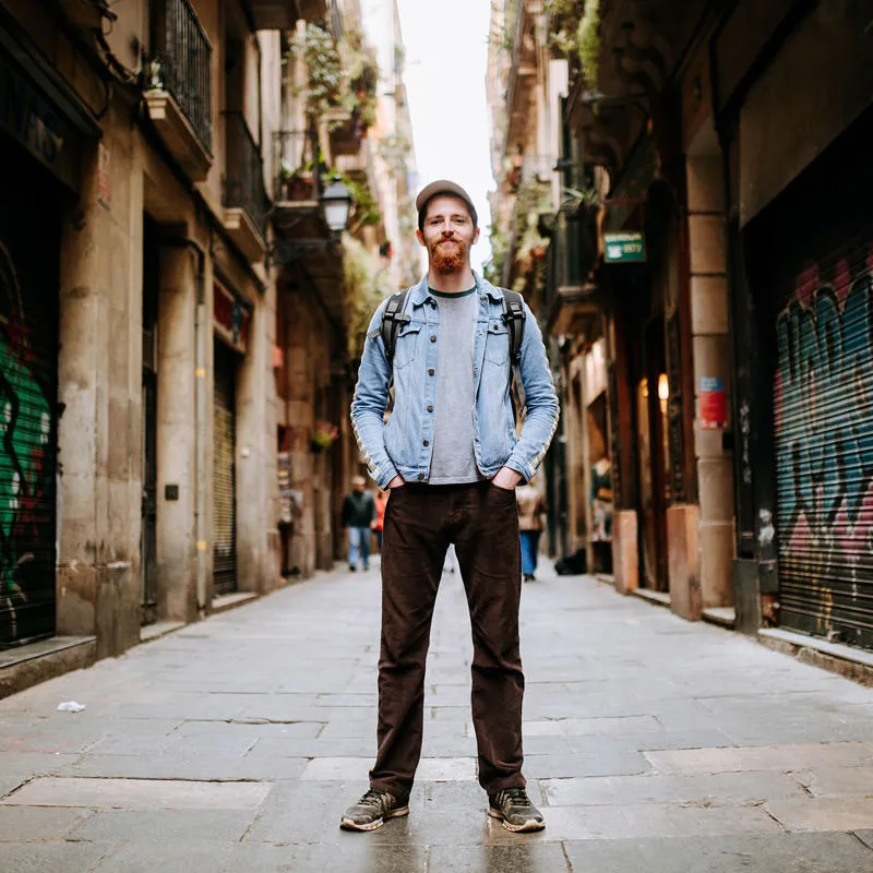 Student standing in a side street in Barcelona