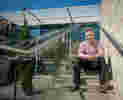 A student seated on building steps