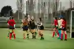 Ladies Hockey celebrating a goal on pitch