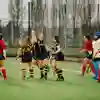 Ladies Hockey celebrating a goal on pitch