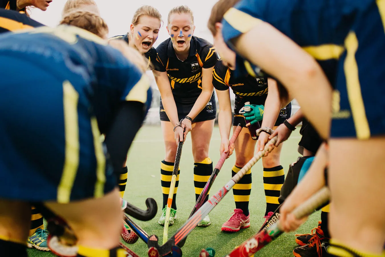 ladies hockey team in a huddle