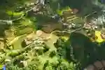 Aerial view of Lao Cai region of Vietnam with stepped green fields and colourful houses