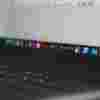 Close-up of laptop screen showing Adobe applications