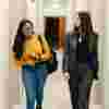 Two students walking down the Legal Advice Centre Corridor