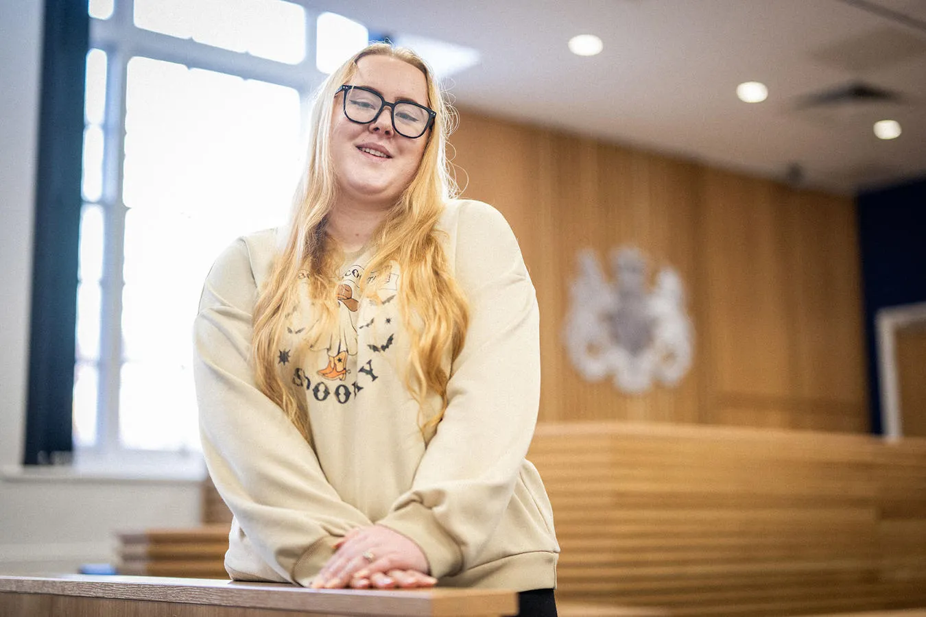 Law student in a mock courtroom