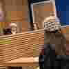 A law student taking part in a trial in the mock courtroom