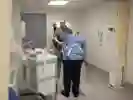 A patient receiving care from a nurse in hospital