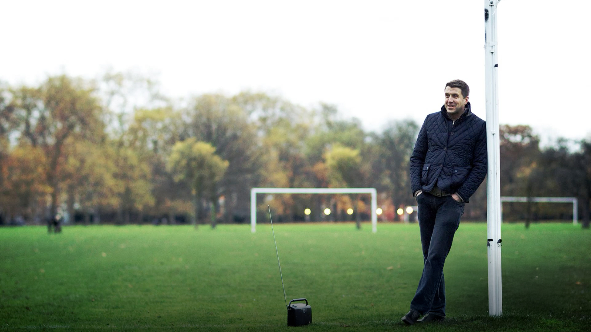 Mark Chapman leans agains a goalpost in a field