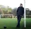 Mark Chapman leans agains a goalpost in a field