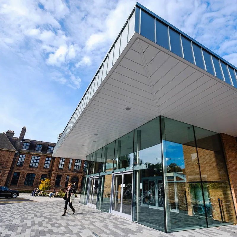 The exterior of the Middleton hall building which is modern style glass and steel pavillion