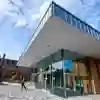 The exterior of the Middleton hall building which is modern style glass and steel pavillion