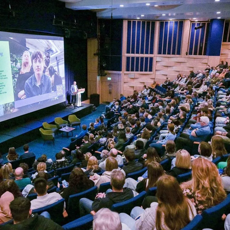 A large crowd watches an Open Day talk in the Middleton Hall concert venue