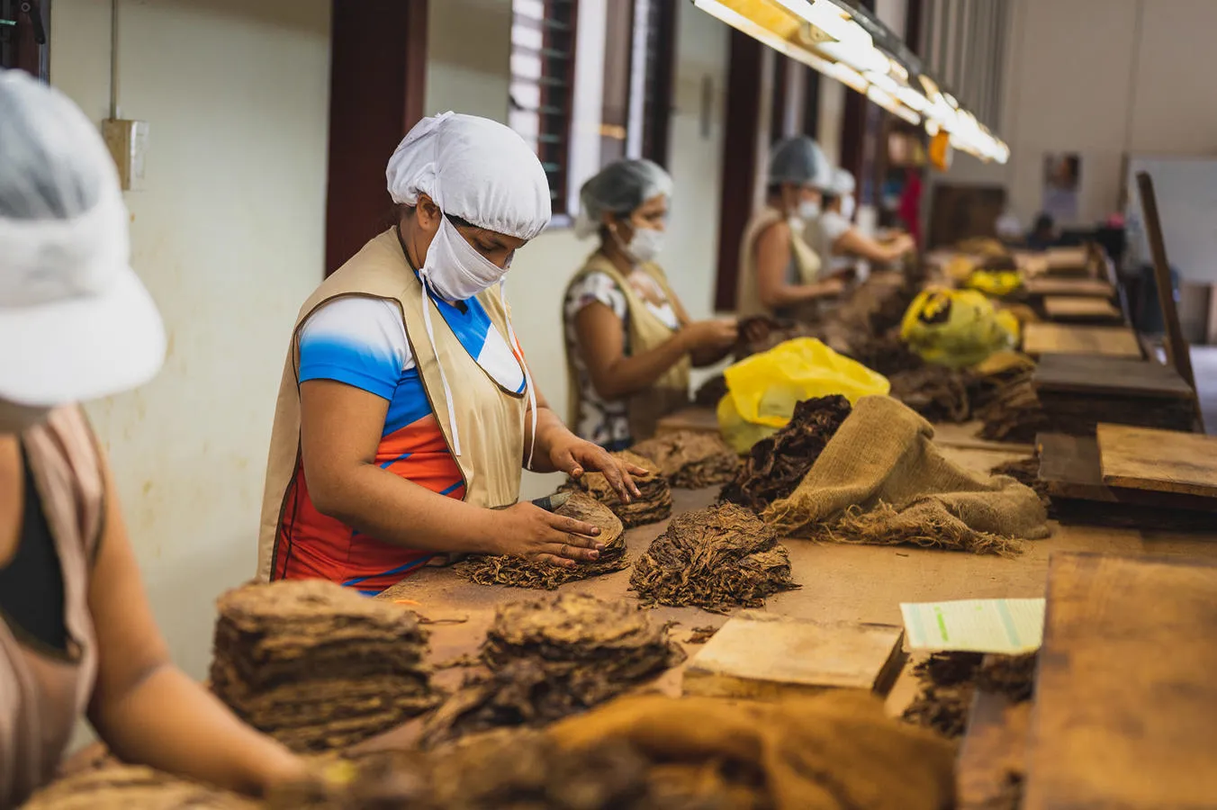 Modern slaves pack hessian bags in squalid conditions