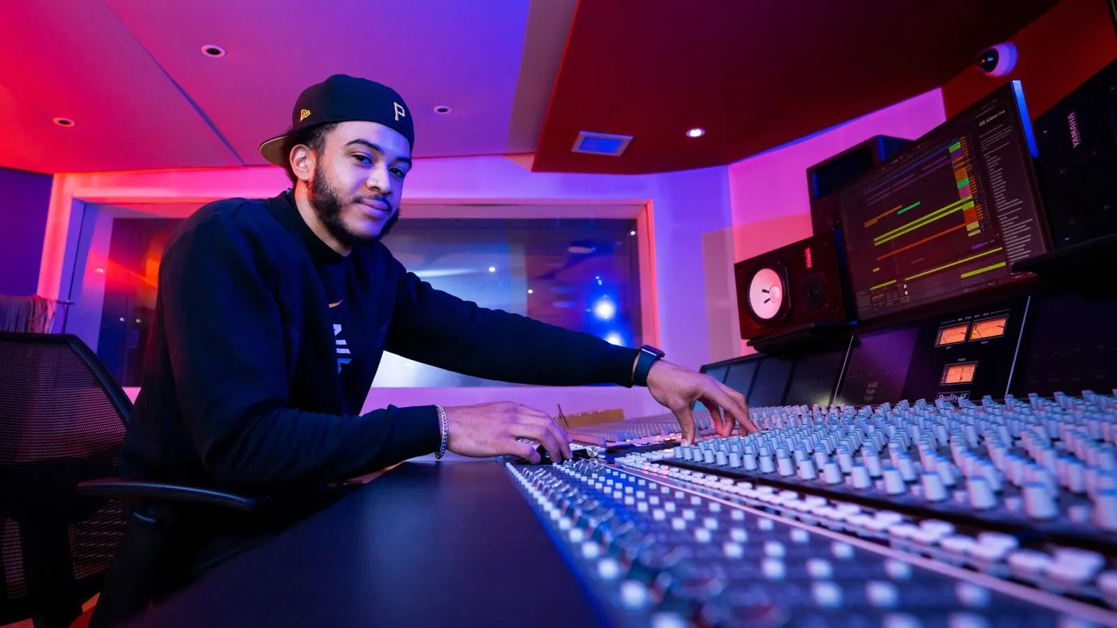 A student on the mixing desk