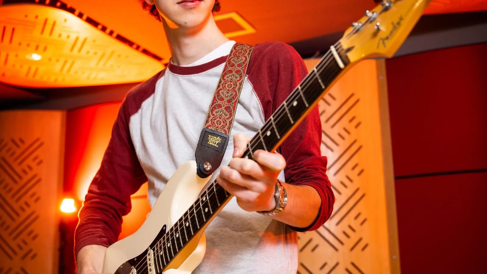 Student playing the guitar