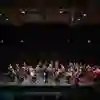 A huge music ensemble on middleton hall stage