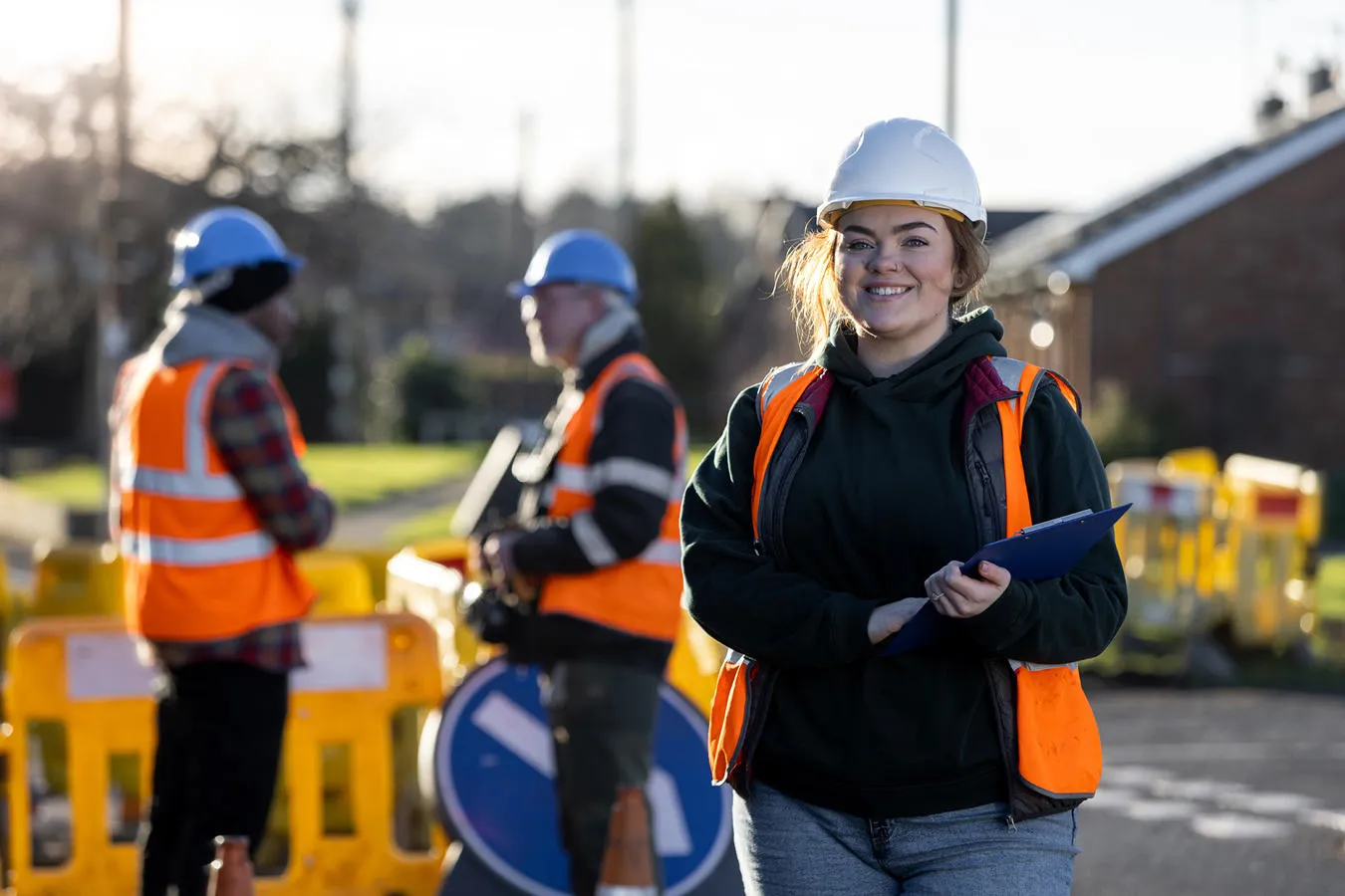 Woman in hard hat and high-visibility jacket 