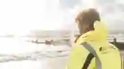 Worker looking out over the sea