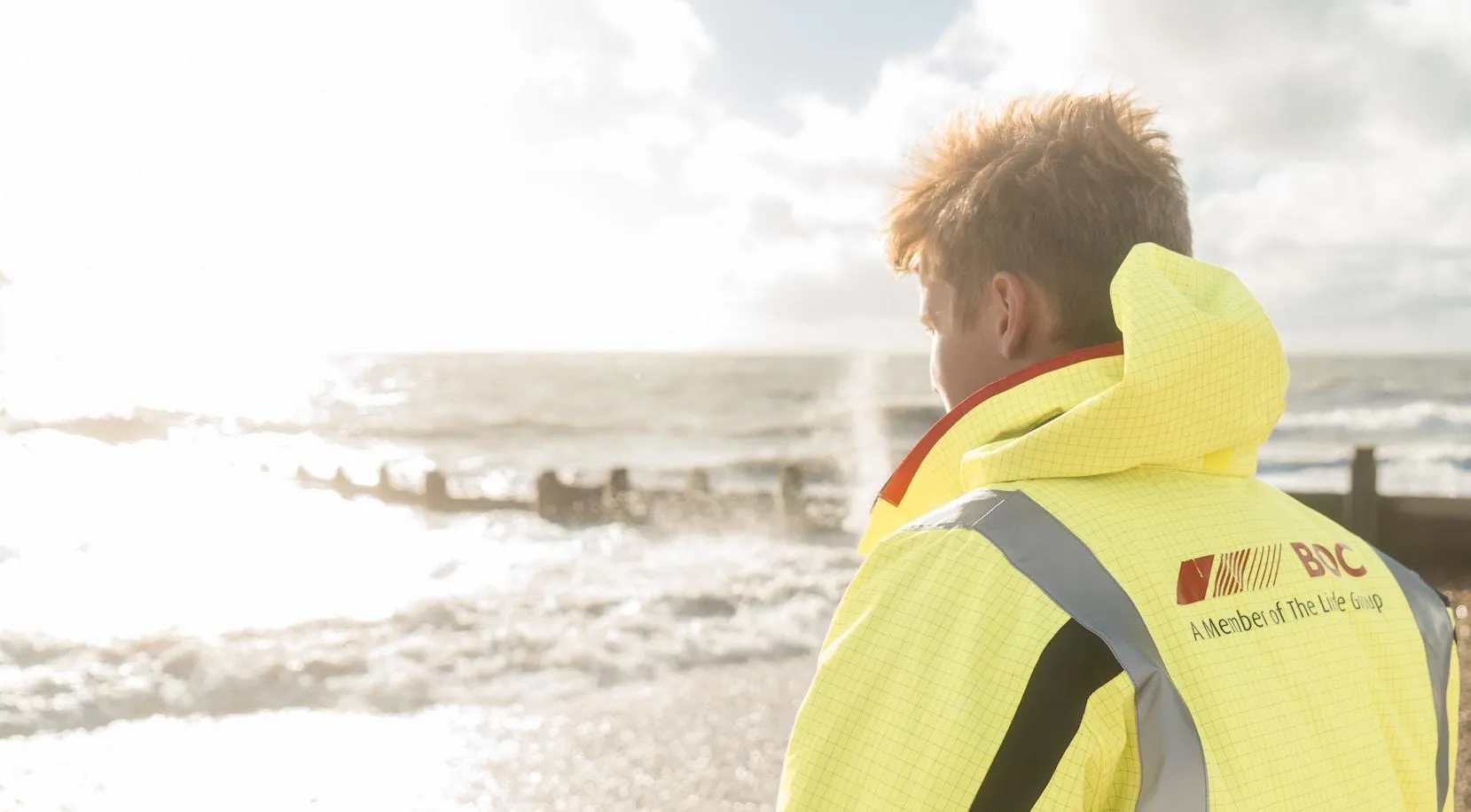 Worker looking out over the sea