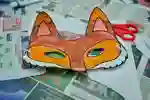A colourful fox mask on a school table