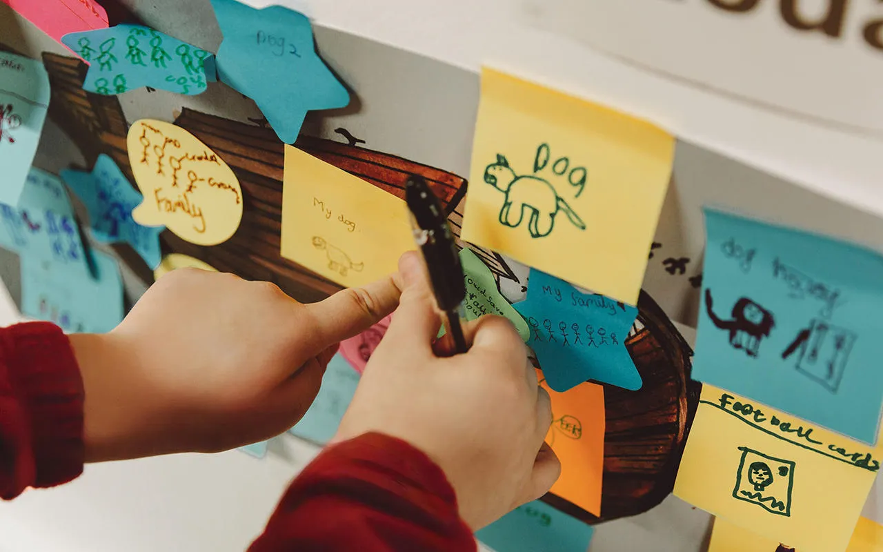 Colourful post-it notes with children's writing and drawings