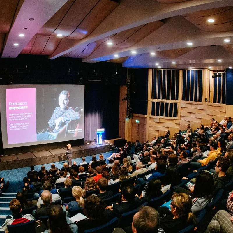 Open day presentation in crowded large theatre