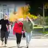 Parents and student walking across campus