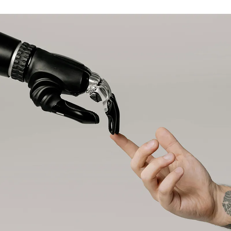 A human and robot hand touch fingertips