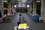 People in a building displaced by war