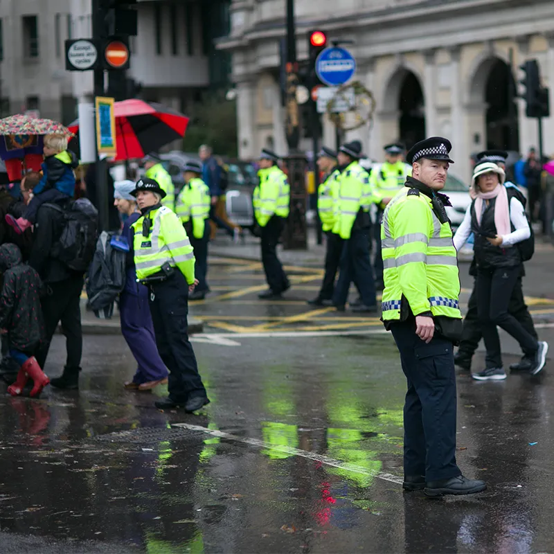 British police officers on a crowded city street