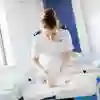 Midwife caring for a newborn baby in a hospital.