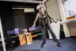A student in the virtual reality studio wearing a Quest headset
