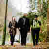 A criminology student walking down a path with two Humberside Police officers