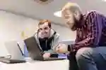 Students looking at laptops