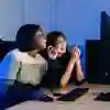 Students looking at a computer