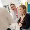 University staff sat a desk working on a project