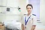 A midwifery student in white uniform at Hull Women and Children's Hospital