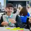 Student at school sitting at a table.