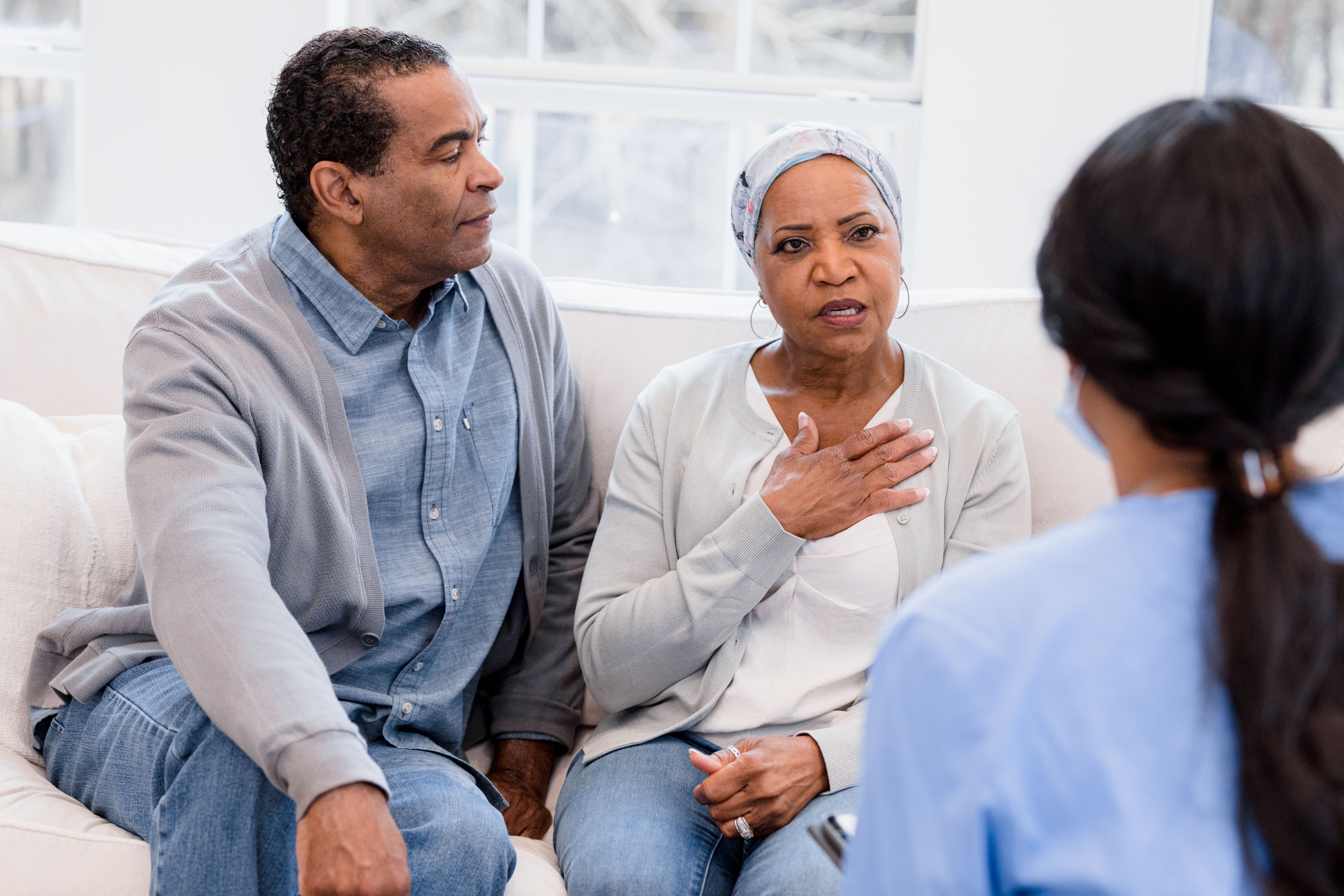 Senior Couple talking to Nurse