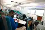 Students sit in lecture theatre