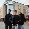 Three students stood outside the Allam Medical Building on University of Hull Campus.