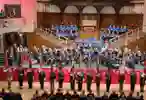 Royal British Legion N & E Yorkshire County Festival Of Remembrance playing instruments on stage