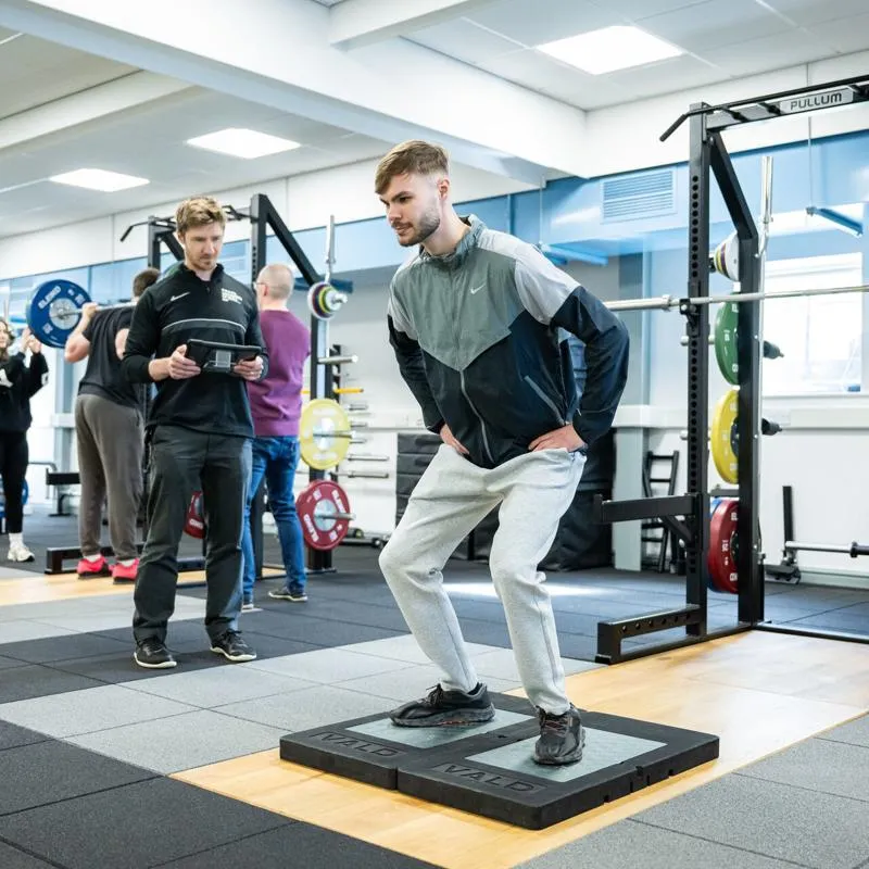 Man performing a jump test on a force plate in the Strength and Conditioning Suite at the University of Hull