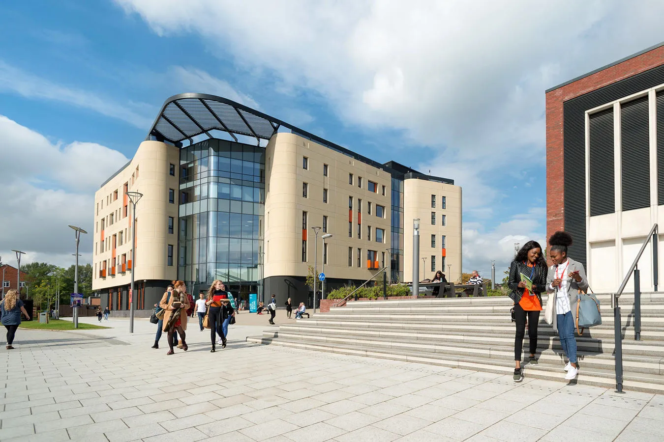 Students on outside allam medical building and library unite