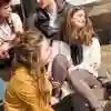 group of students hanging out on campus