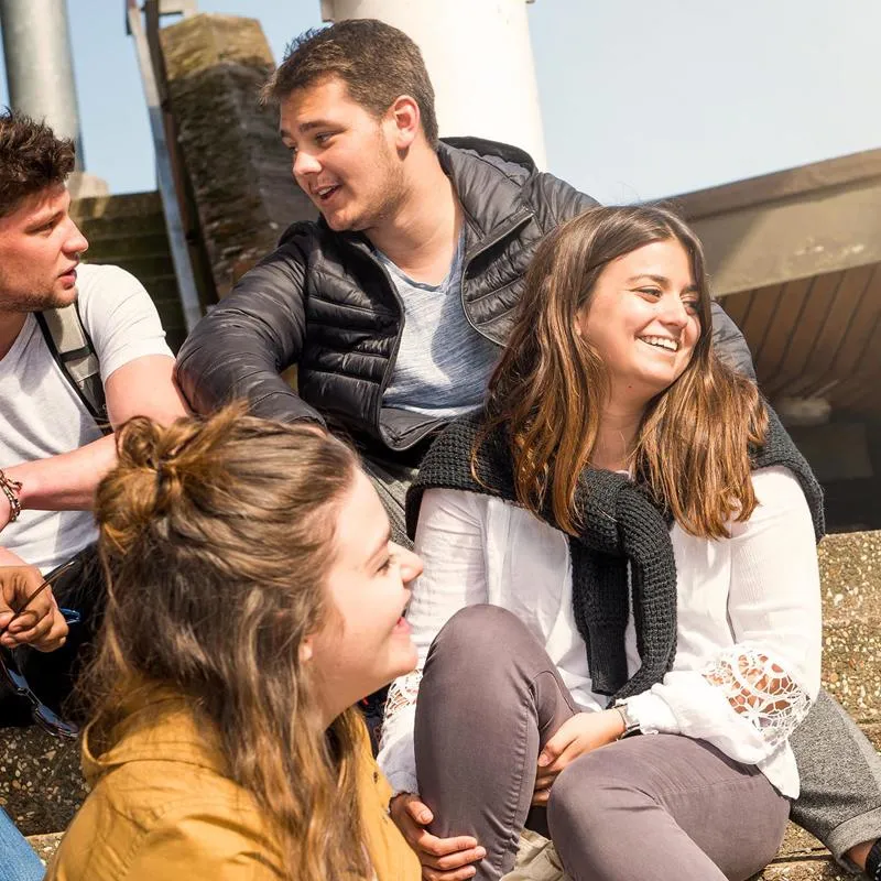group of students hanging out on campus