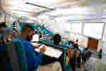 Students sit in lecture theatre